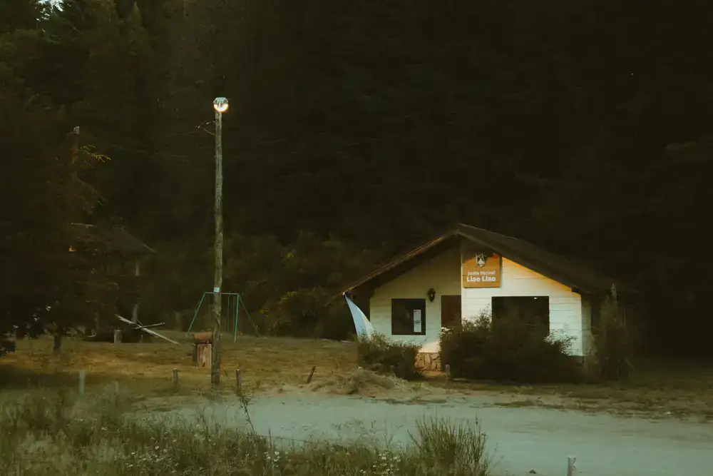 A small cabin in dark woods